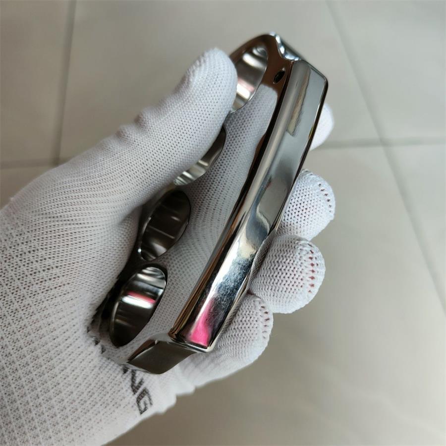 Polished Titanium Knuckle Duster with Sleek Reflective Surface